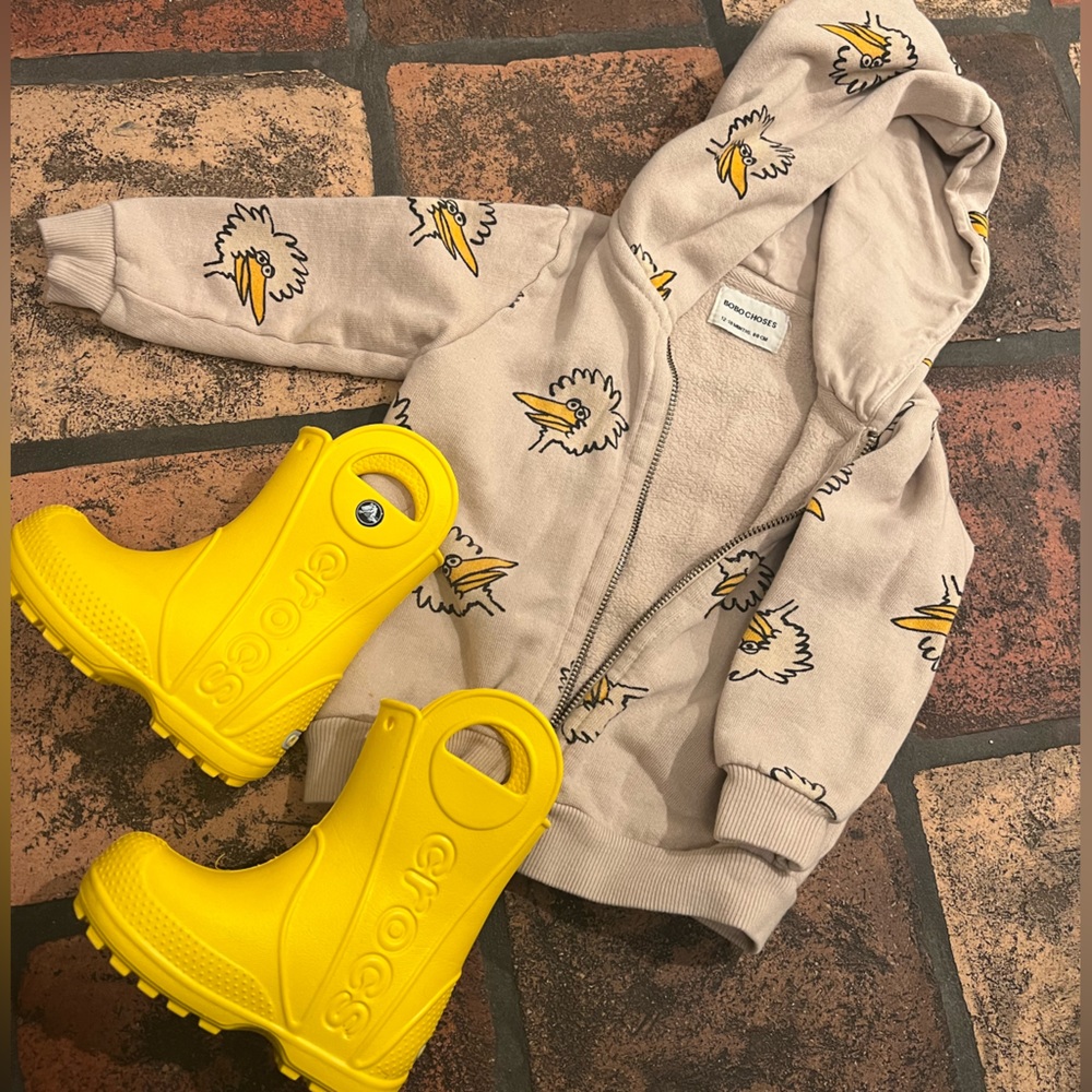 A sweet rainy day big bird Bobo Choses sweatshirt with bright yellow crocs